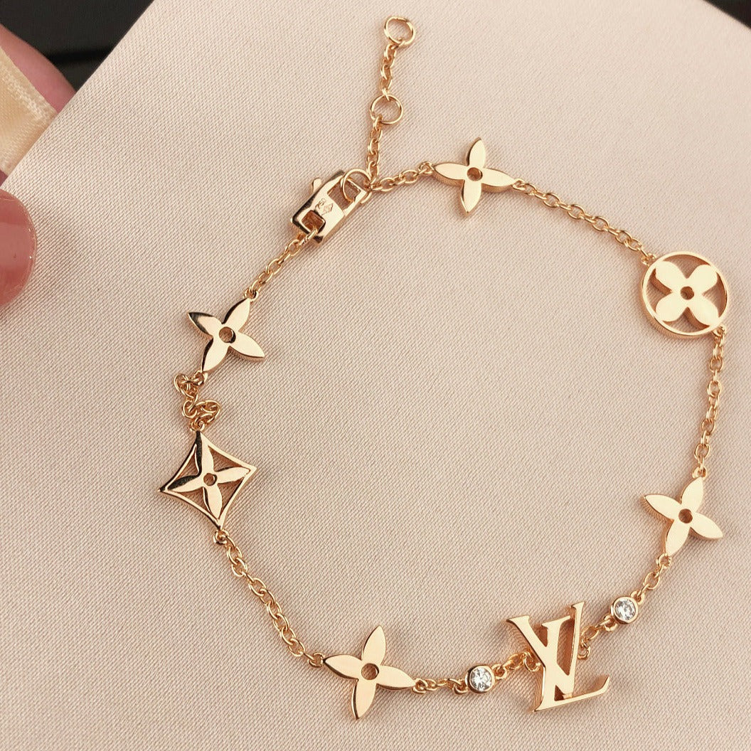 TimiSTAR AND SUN 7 MOTIFS GOLD BRACELET