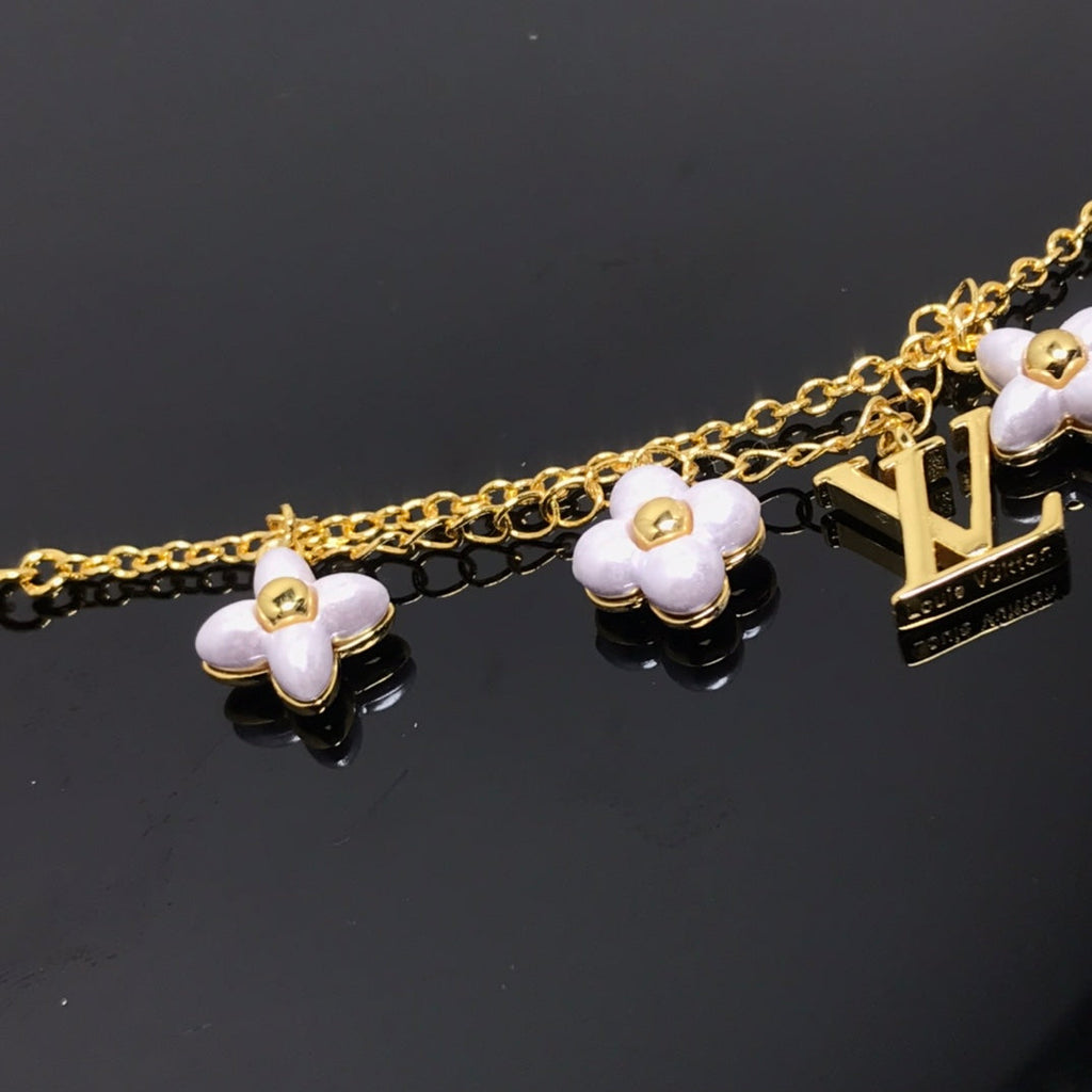 TimiLOGO 6 MOTIF STAR AND SUN GOLD BRACELET